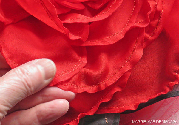 The custom red silk organza peony flower trim on the "Z Shin Forward" hat by MAGGIE MAE DESIGNS