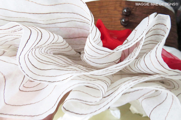 Silk organza ruffle brim layers on the "Big Brown" hat