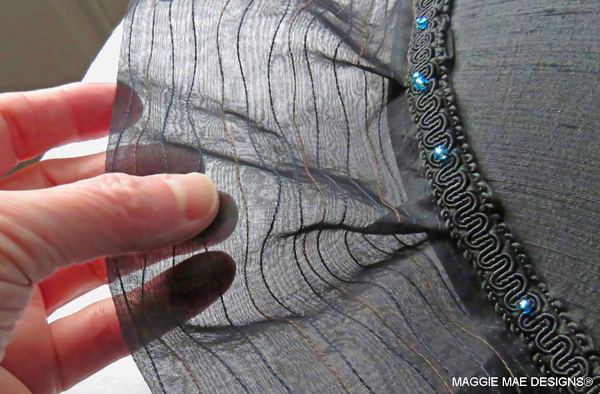 Black silk organza brim layer topstitched with deep blue and black threads