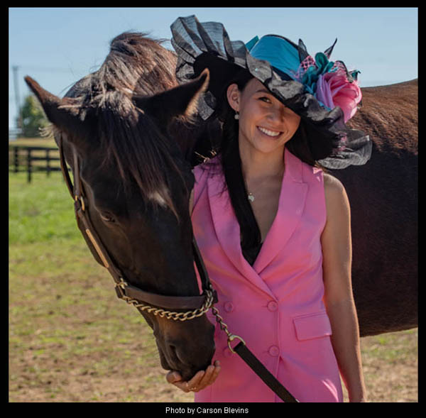 Andie Biancone, Reporter/Racing Analyst at FanDuel Racing modeling the "Cozmic One" Derby hat for "Hats Off to the Horses" 2026