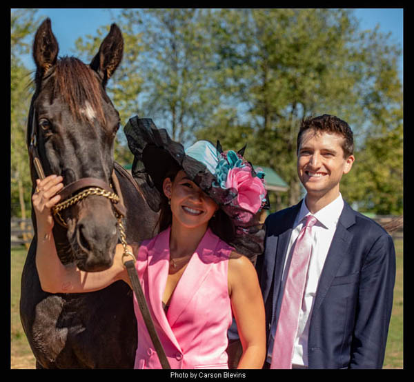 Andie Biancone, Reporter/Racing Analyst at FanDuel Racing modeling the "Cozmic One" Derby hat with jockey Keith Asmussen for "Hats Off to the Horses"